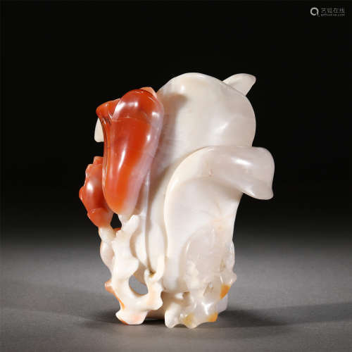 A SOUTH RED AGATE CARVED ORCHID FLOWER HOLDER
