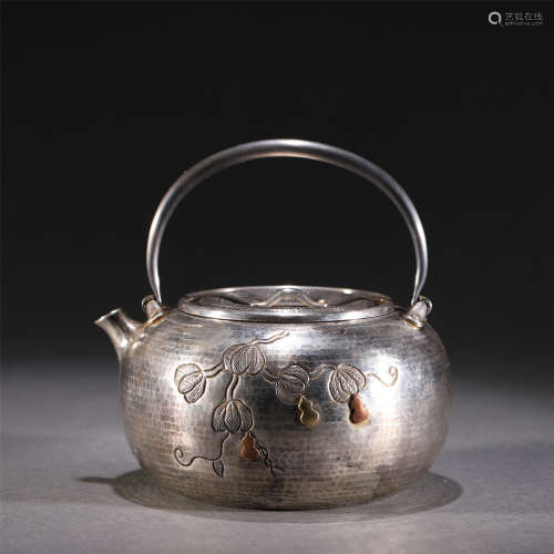 A SILVER INLAID GOLD KETTLE