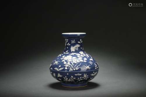 Carved Porcelain Vase with Flower and Bird Patterns on a Blu...