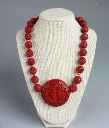 A Cinnabar Lacquer Pendant with Necklace