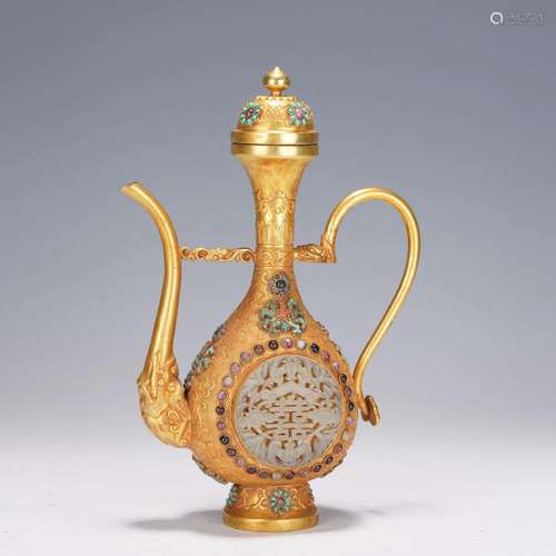 A CHINESE GILT BRONZE INLAID GEMSTONES HANDLED EWER