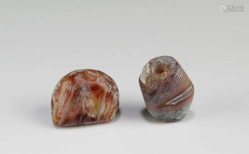 A Group of Two Tibetan 'First-Line' Dzi Beads