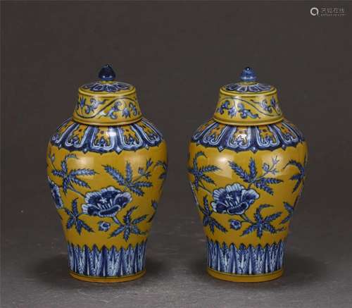 A CHINESE YELLOW GLAZE BLUE AND WHITE PORCELAIN JARS