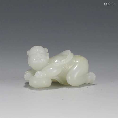 A CHINESE SOAP STONE JADE BOY