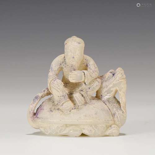 A CHINESE JADE FIGURE