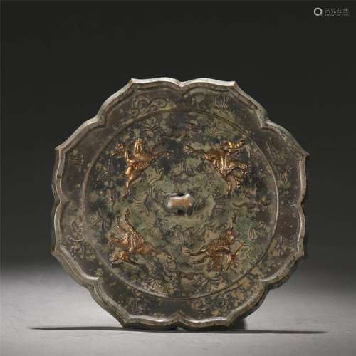 A CHINESE BRONZE MIRROR