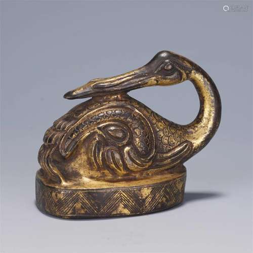 A CHINESE GILT BRONZE PAPER WEIGHT