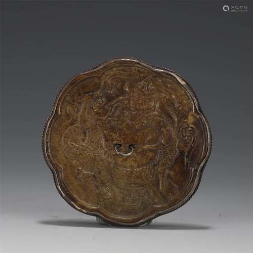 A CHINESE BRONZE MIRROR