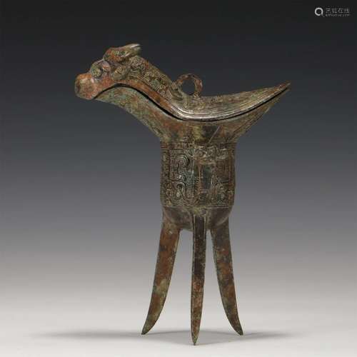 A CHINESE BRONZE TRIPOD CUP