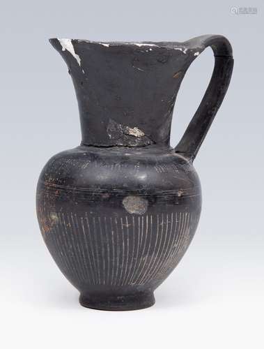 Etruscan jug. 6th century BC. In black bucchero. Measures: 1...