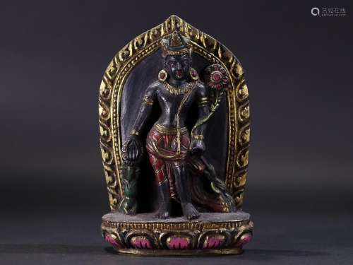 GILT-LACQUER DECORATED BLACK STONE FIGURE OF GUANYIN