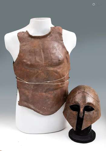 Greek helmet and pectoral, V-IV century BC. Bronze. Measures...