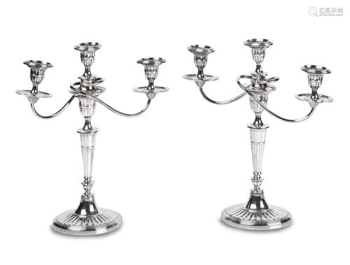 A PAIR OF GEORGE III STYLE SILVER PLATE THREE LIGHT CANDELAB...