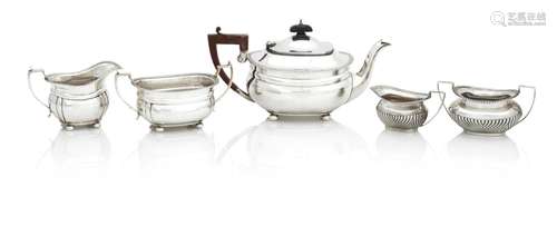 A SILVER THREE PIECE TEA SET OF RECTANGULAR FORM