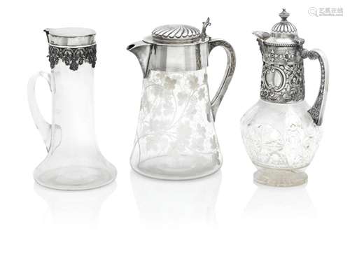 THREE LATE VICTORIAN SILVER-MOUNTED CLARET JUGS