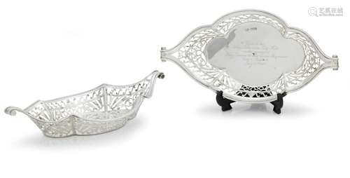 ROYAL INTEREST: A PAIR OF PIERCED SILVER NAVETTE-SHAPED DISH...