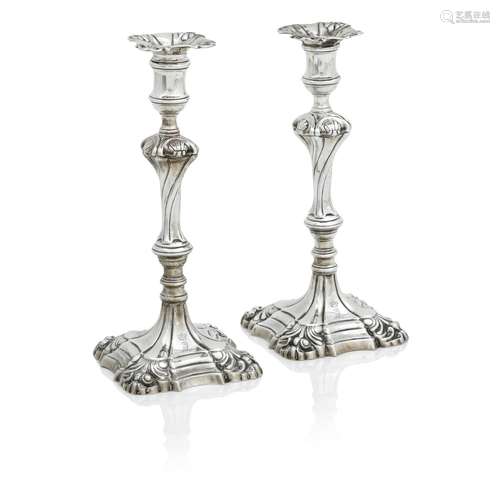 A PAIR OF GEORGE III CAST SILVER CANDLESTICKS