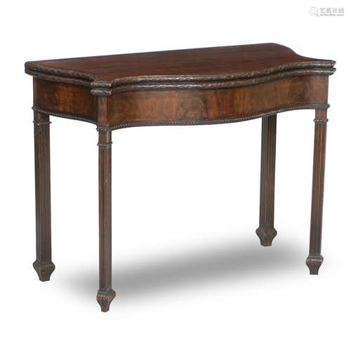 An EDWARDIAN SERPENTINE MAHOGANY CARD TABLE