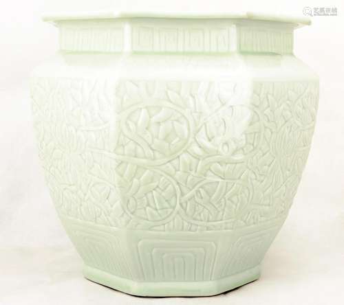 A GREEN GLAZE PORCELAIN JAR CARVED WITH LOTUS FLOWERS.