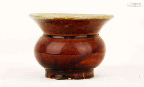 A GARNET-GLAZE INCISED-DESIGN PORCELAIN ZHADOU.C323.