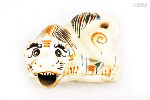 A TIGER SHAPED PORCELAIN BUILDING COMPONENT. C331.