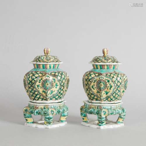 A Pair of Chinese Famille Verte Lidded Jars with bases