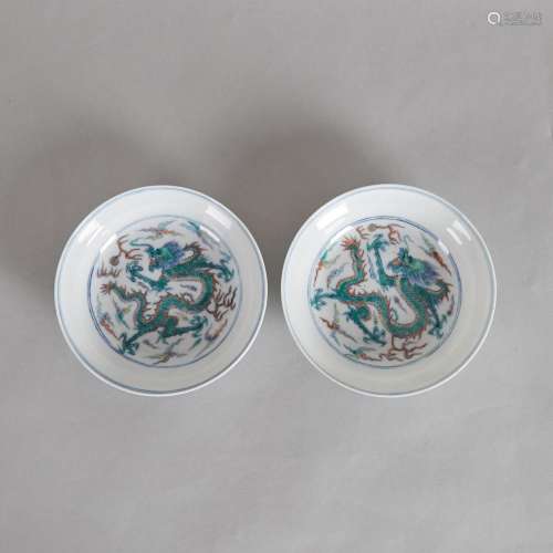 A Pair of 18th Century Chinese Doucai 'Dragon' Sau...