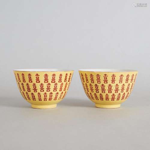 A Pair of Chinese Yellow-ground Iron-red 'Xi' Bowl...