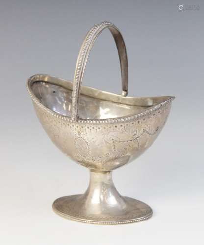 A George III silver swing-handled sugar basket, Samuel Wood,...
