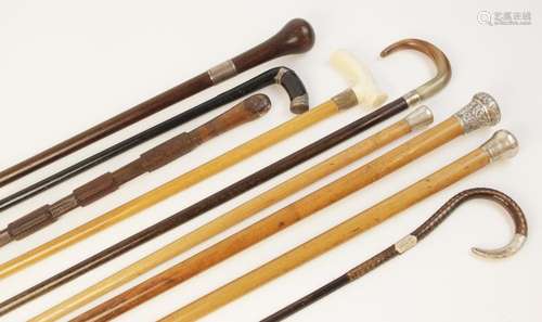 A Victorian lacquered hard wood walking cane, scale effect c...