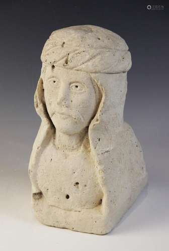 A carved stone corbel depicting the bust of a noble gentlema...