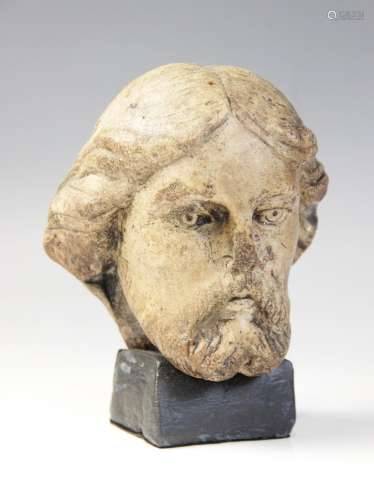 A carved marble male head possibly Christ, modelled with det...