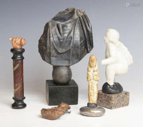 A selection of carvings and antiquities, to include a carved...