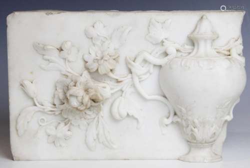 A marble carving fragment, depicting a classical urn within ...