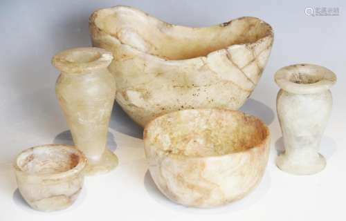 A selection of carved alabaster vessels, to include a navett...