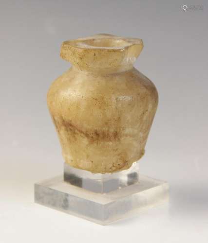 An Egyptian Middle Kingdom alabaster kohl vessel, circa 2000...