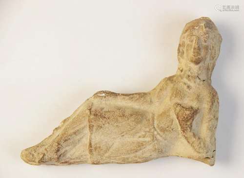 A limestone reclining figure, leaning on the left elbow and ...