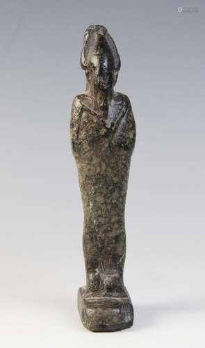 An Egyptian basalt mummiform figure of Osiris, with carved d...