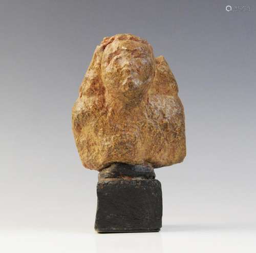 An Egyptian style worn bust, wearing a bag wig, Not Ancient,...