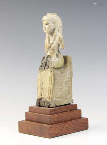 An Egyptian style fragmentary steatite statue of Isis seated...