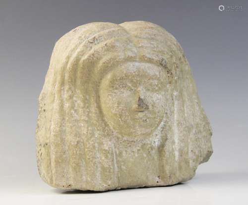 An Egyptian style limestone bust of a woman, 16.5cm high and...