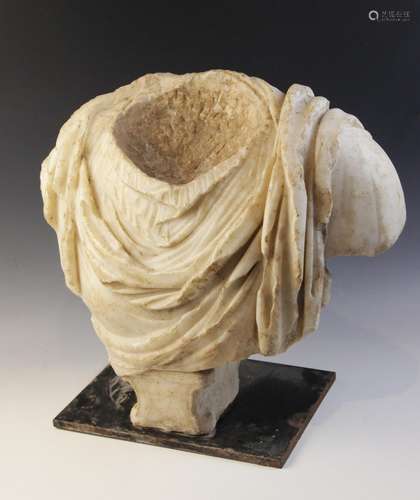 A Roman marble bust with the folds of the tunic deeply carve...