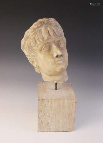 A marble head of an emperor, probably Nero, wearing a wreath...