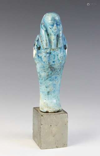 An Egyptian style bright blue glazed faience shabti, 13cm hi...