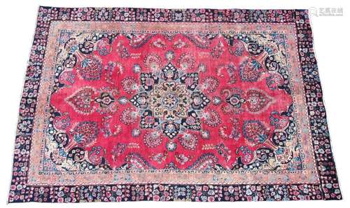 * A Persian pattern wool rug, the central eight branch blue ...