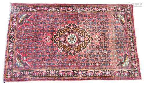 * A Persian pattern wool rug, of traditional design, the cen...