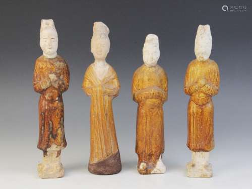Four Chinese pottery amber glazed figures, possibly Tang dyn...