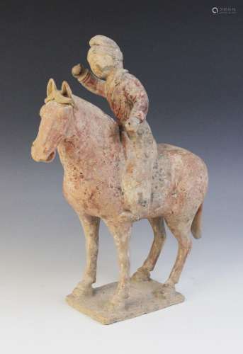 A Chinese pottery model of a polo player on horseback, possi...
