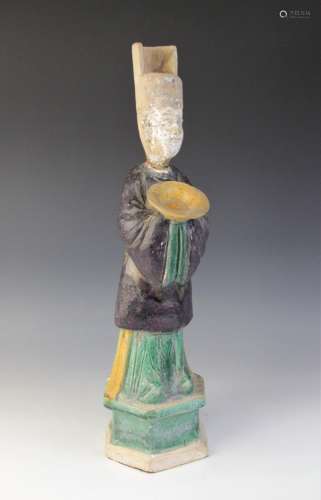 A large Chinese Sancai glazed attendant, possibly Tang dynas...