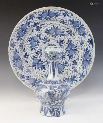 A Dutch delft charger, 18th century, busily decorated in blu...